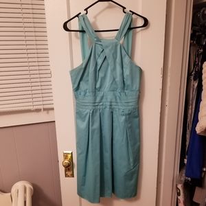 Pool blue dress with y-neck and skirt pleating